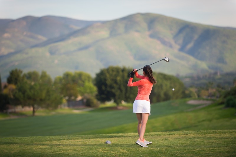 Young Hispanic Women Playing Golf