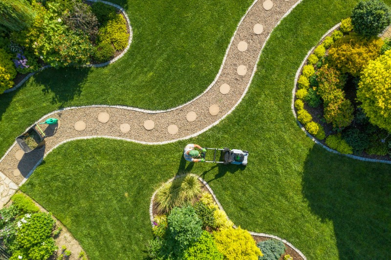 Big Garden Grass Field Mowing by Caucasian Gardener