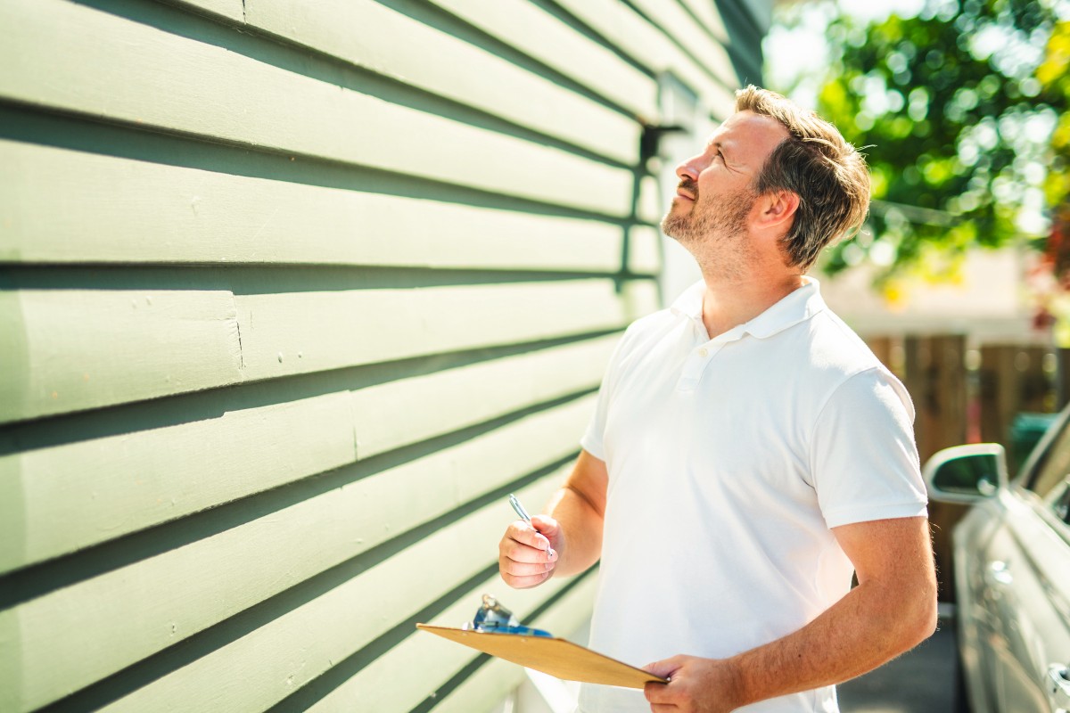 Inspector or engineer is checking the building structure and house. After the renovate is complete